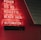 Red neon letters are mounted on a dark tiled wall, displaying the words Poker, Sic Bo, Roulette, Black Jack, and Automaten.